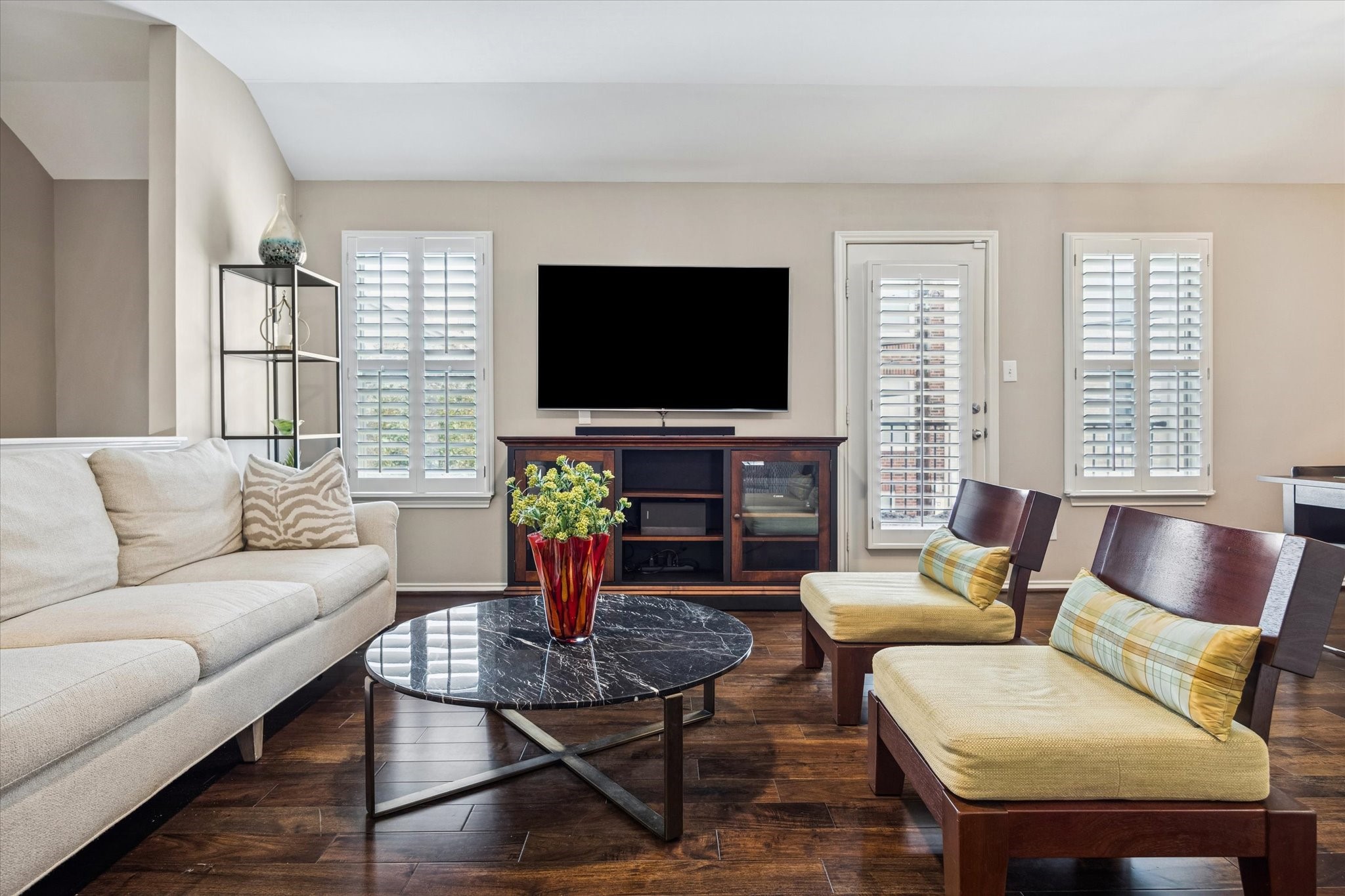 1810 Gillette Street Houston, TX 77019 - Photo 9 of 25 a living room with furniture a flat screen tv and a large window