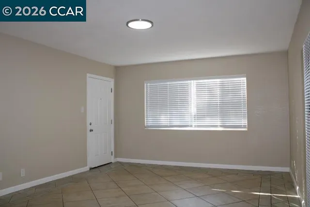 a view of an empty room with a window