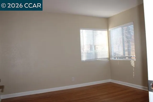 a view of a room that has a window in it