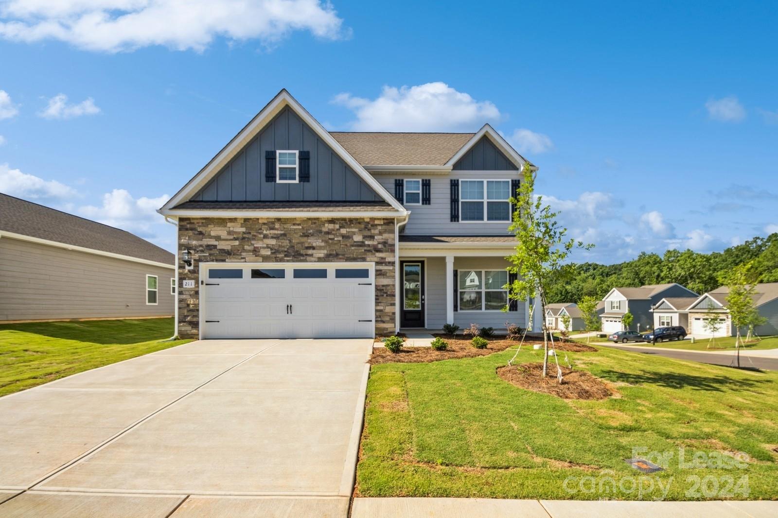 211 Adams Tree Way Troutman, NC 28166 - Photo 1 of 32 a front view of house with yard