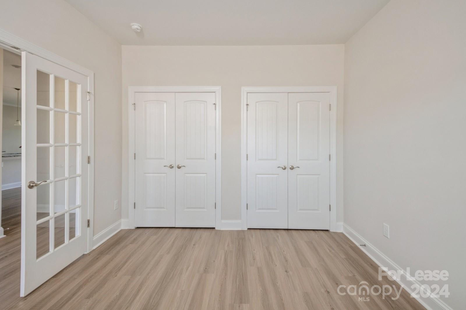 211 Adams Tree Way Troutman, NC 28166 - Photo 12 of 32 wooden floor in an empty room