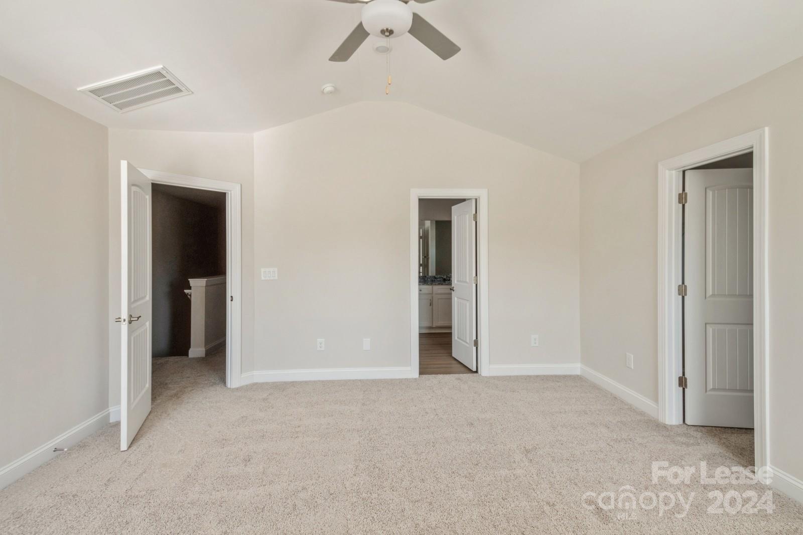 211 Adams Tree Way Troutman, NC 28166 - Photo 14 of 32 a view of an empty room with a ceiling fan