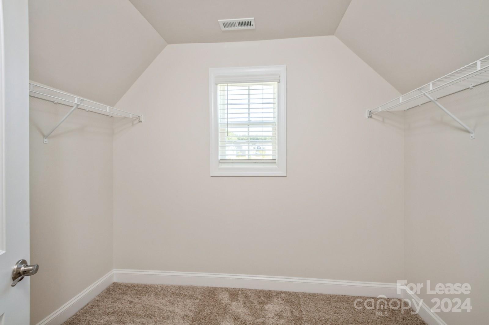 211 Adams Tree Way Troutman, NC 28166 - Photo 17 of 32 a view of a room that has a window in it