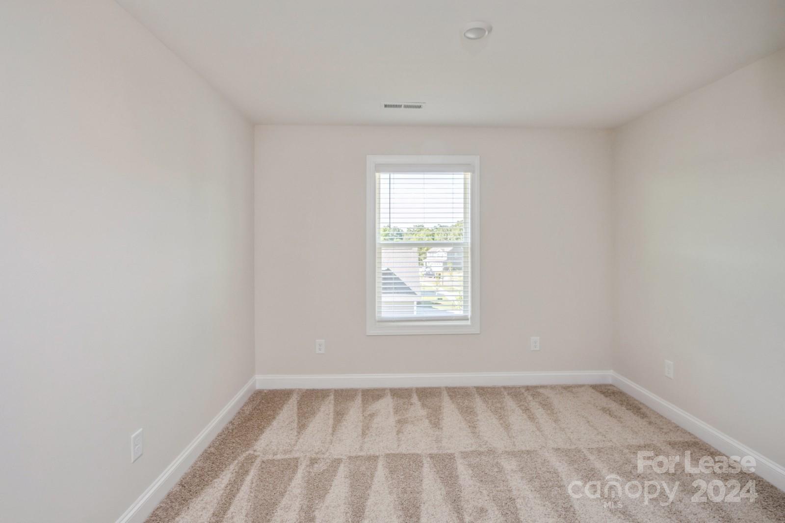 211 Adams Tree Way Troutman, NC 28166 - Photo 18 of 32 a view of a room that has a window