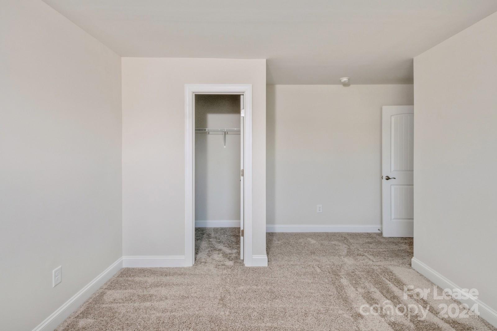 211 Adams Tree Way Troutman, NC 28166 - Photo 19 of 32 an empty room with closet