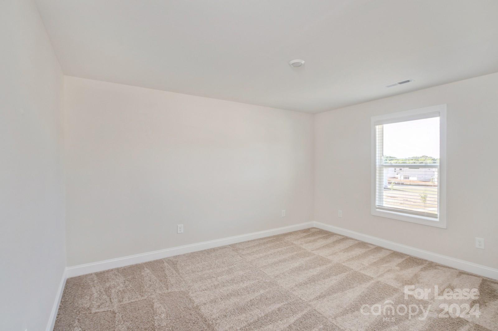 211 Adams Tree Way Troutman, NC 28166 - Photo 20 of 32 an empty room with a window