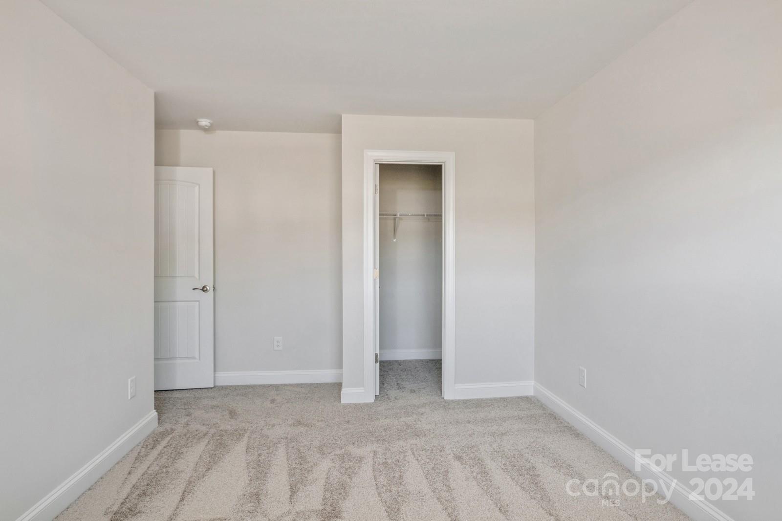 211 Adams Tree Way Troutman, NC 28166 - Photo 23 of 32 a view of an empty room