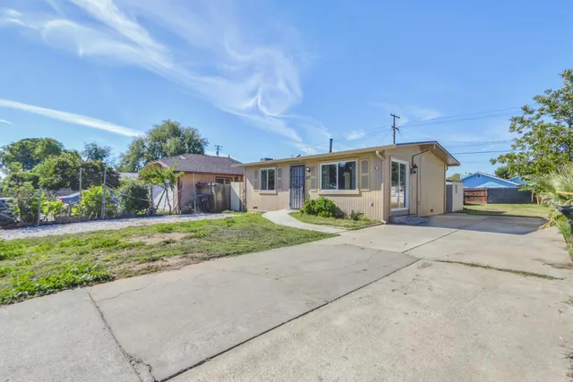 front view of a house with a yard