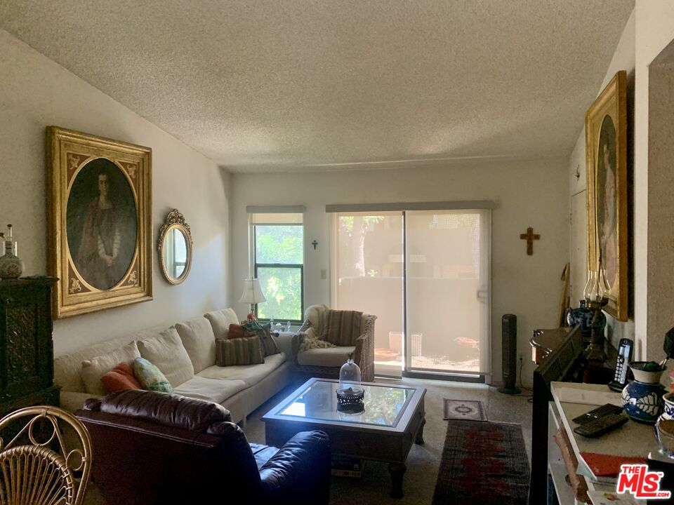 7312 Corbin Avenue, Unit M Reseda, CA 91335 - Photo 3 of 18 a living room with furniture and a large window