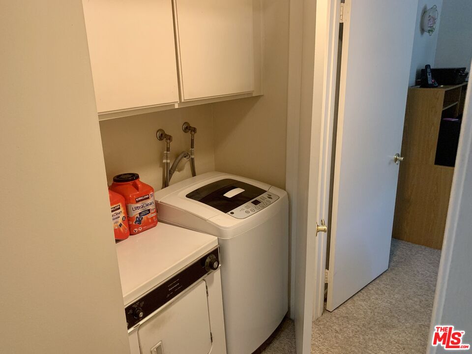 7312 Corbin Avenue, Unit M Reseda, CA 91335 - Photo 8 of 18 a utility room with dryer and washer