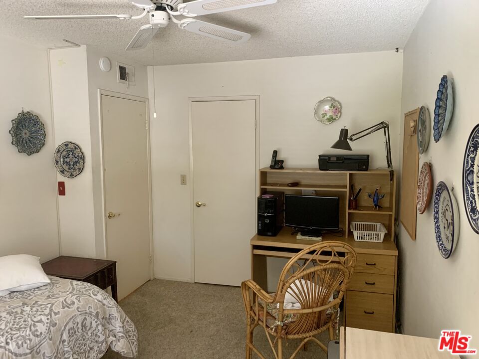 7312 Corbin Avenue, Unit M Reseda, CA 91335 - Photo 9 of 18 a bedroom with a bed and furniture