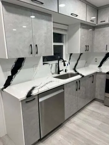 a kitchen with a sink and a mirror