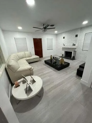 a living room with furniture and a fireplace