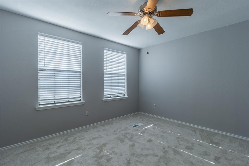 449 Harris Street, Unit 103C Coppell, TX 75019 - Photo 14 of 17 Unfurnished room with ceiling fan and carpet flooring
