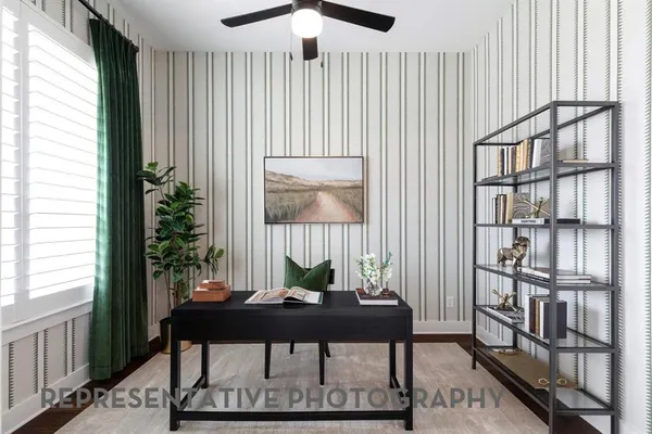 a view of a livingroom with furniture and window