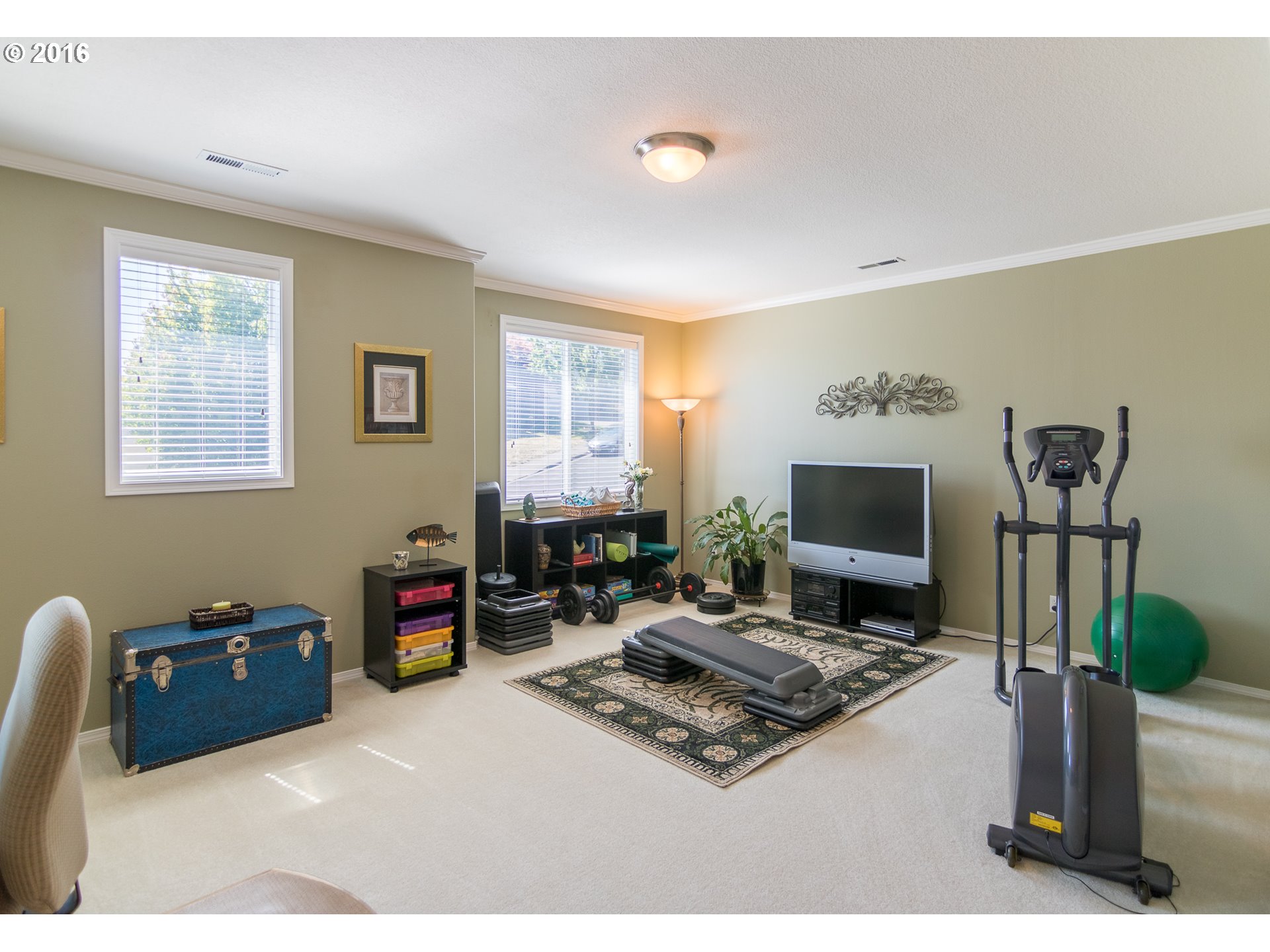 15806 Southwest Colyer Way Tigard, OR 97224 - Photo 14 of 32 a living room with furniture a flat screen tv and a fireplace