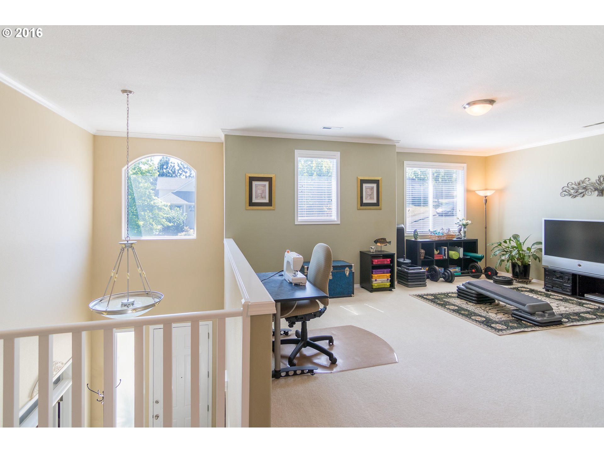 15806 Southwest Colyer Way Tigard, OR 97224 - Photo 15 of 32 a living room with furniture a flat screen tv and a large window
