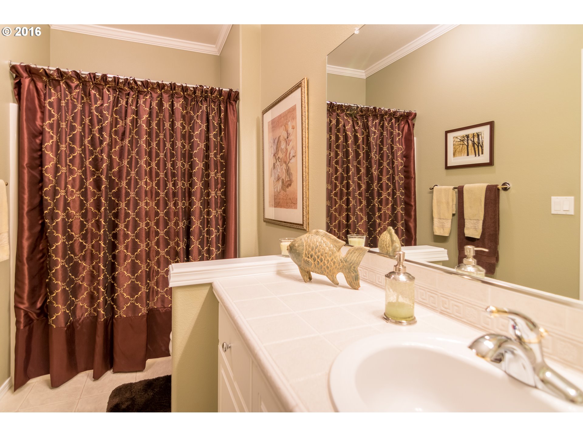 15806 Southwest Colyer Way Tigard, OR 97224 - Photo 17 of 32 a bathroom with a sink and a mirror
