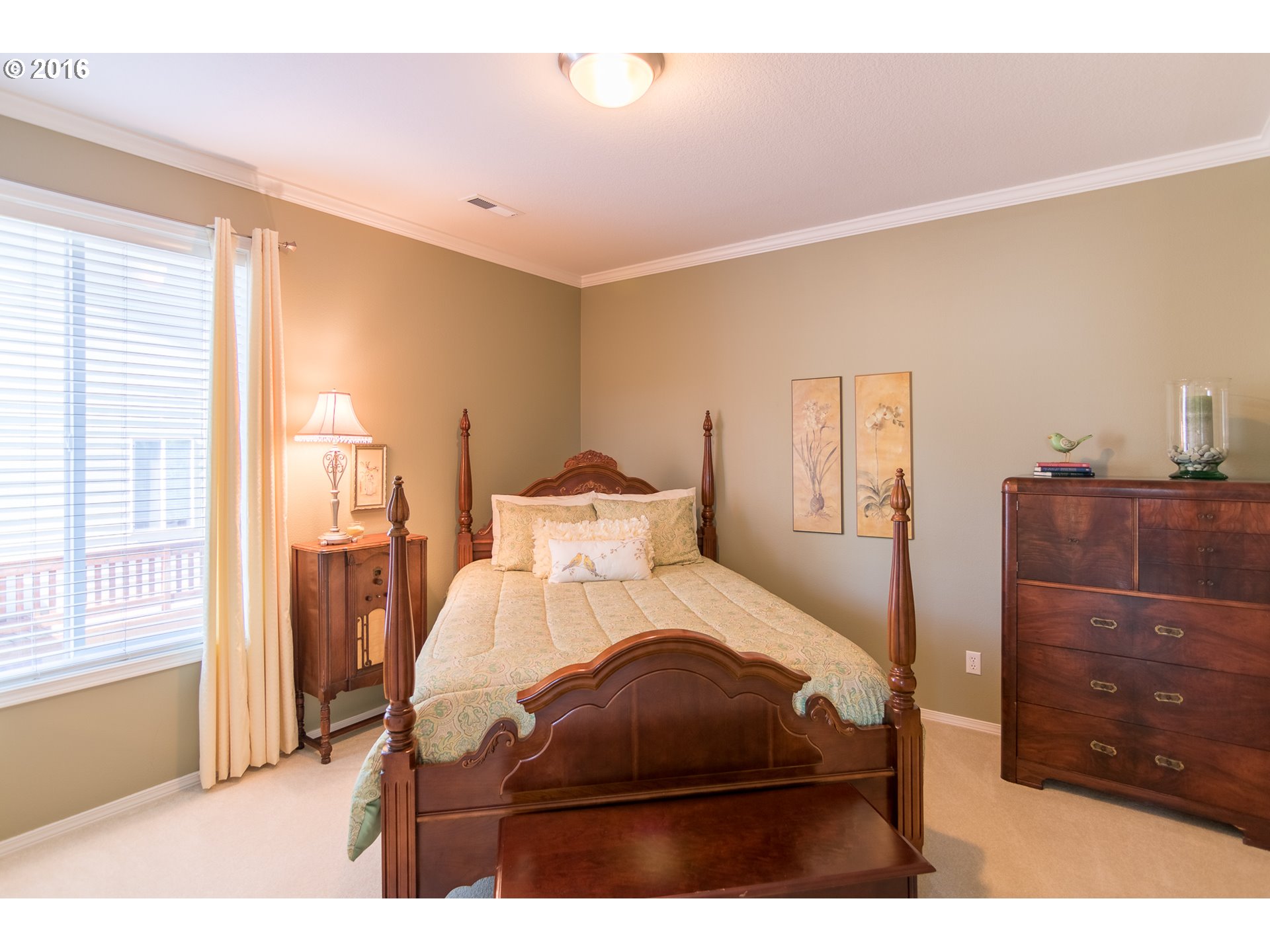 15806 Southwest Colyer Way Tigard, OR 97224 - Photo 18 of 32 a bedroom with a bed window and a mirror
