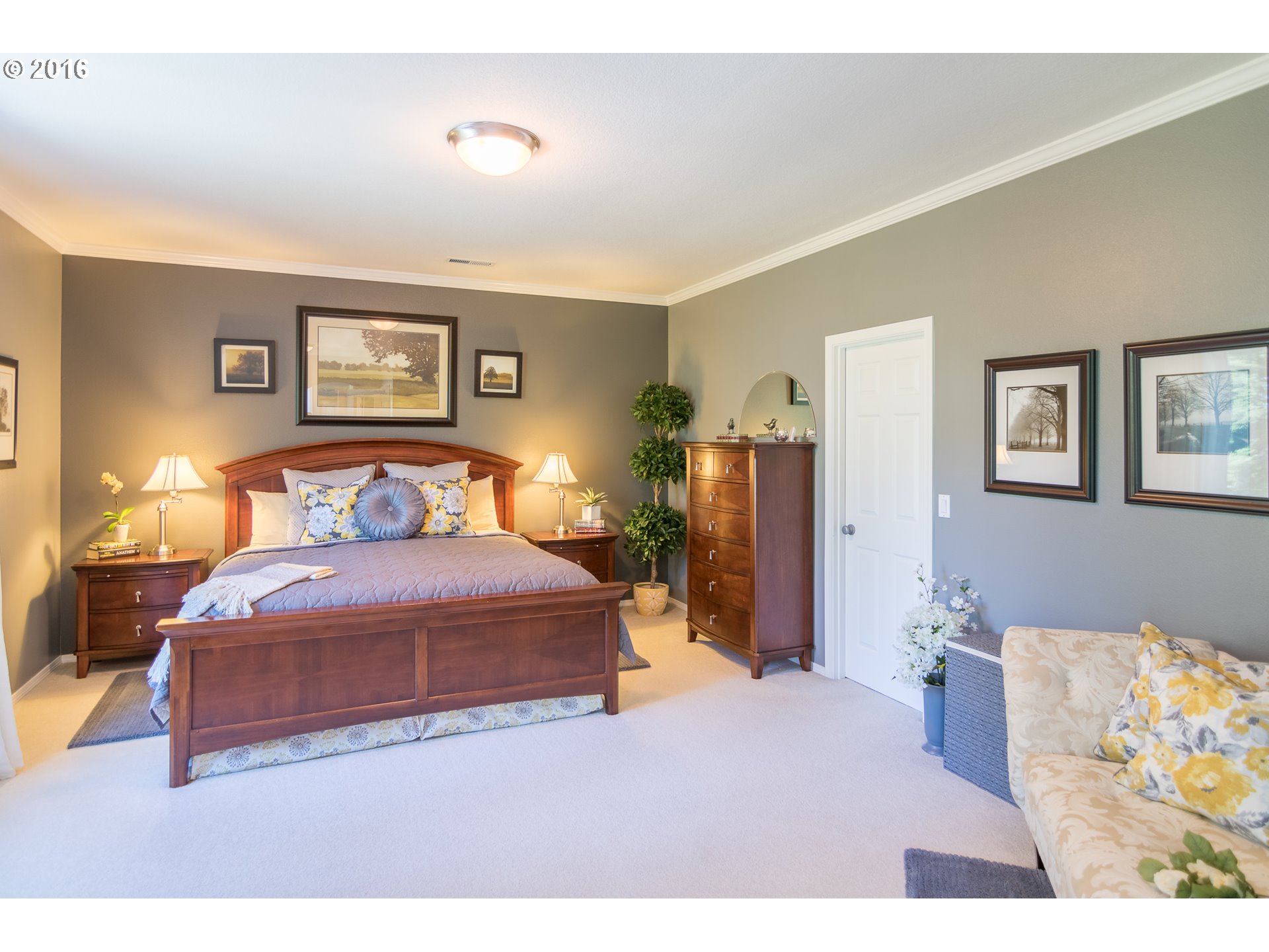 15806 Southwest Colyer Way Tigard, OR 97224 - Photo 20 of 32 a bedroom with a bed and a lamp