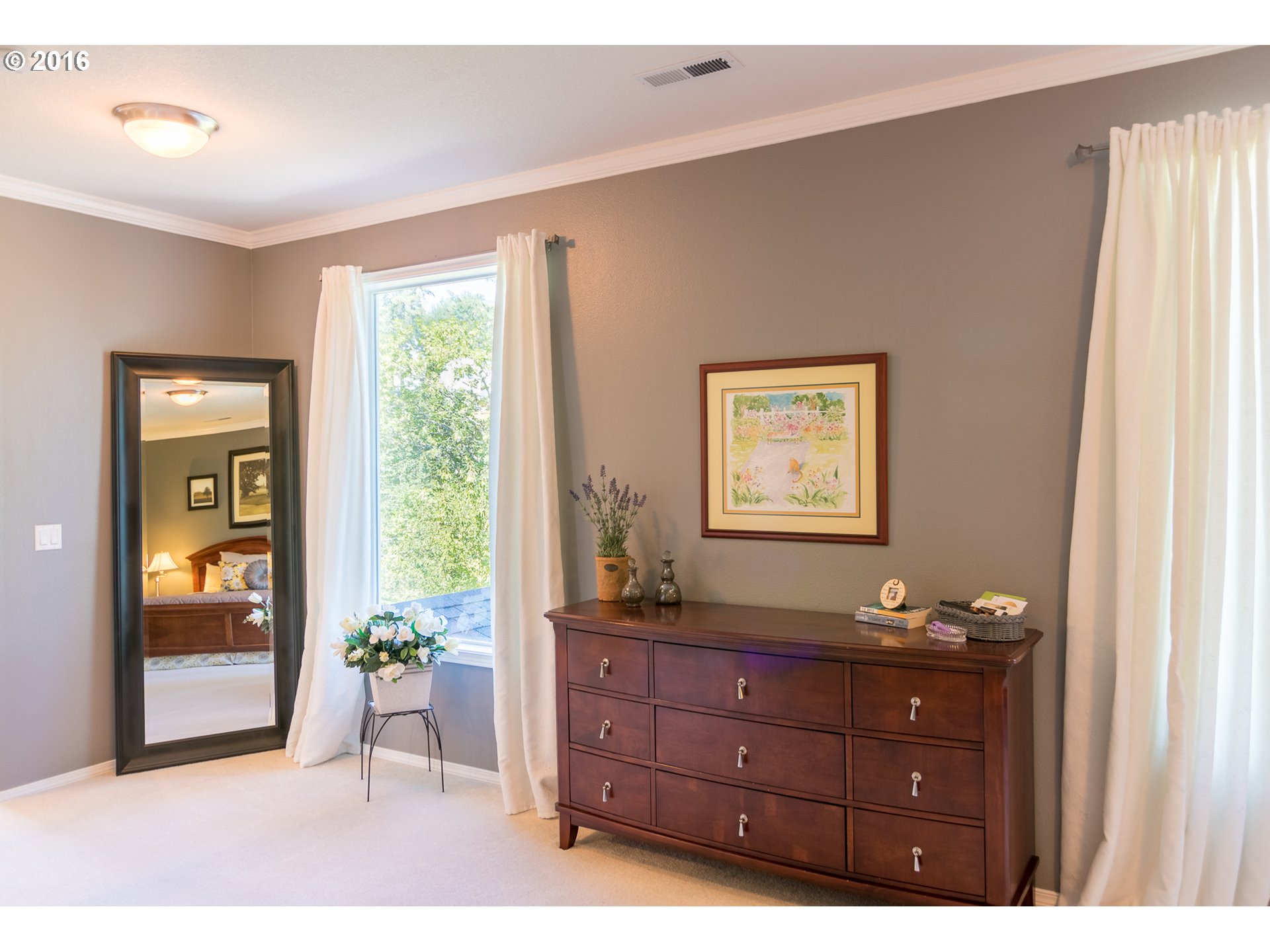 15806 Southwest Colyer Way Tigard, OR 97224 - Photo 22 of 32 a bed room with a bed and a dresser