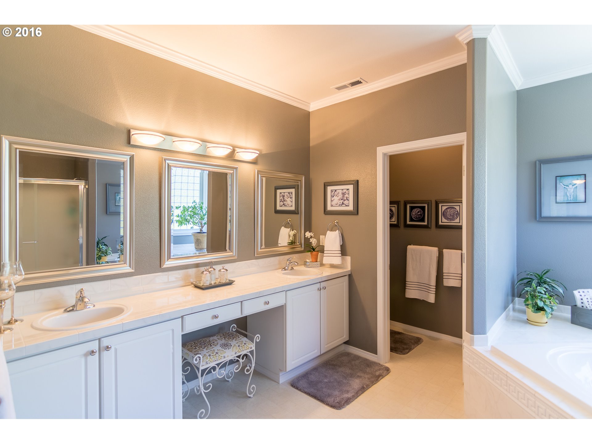 15806 Southwest Colyer Way Tigard, OR 97224 - Photo 23 of 32 a bathroom with a sink and a mirror