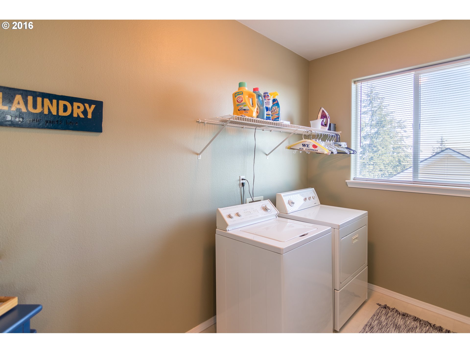 15806 Southwest Colyer Way Tigard, OR 97224 - Photo 25 of 32 a utility room with dryer and washer