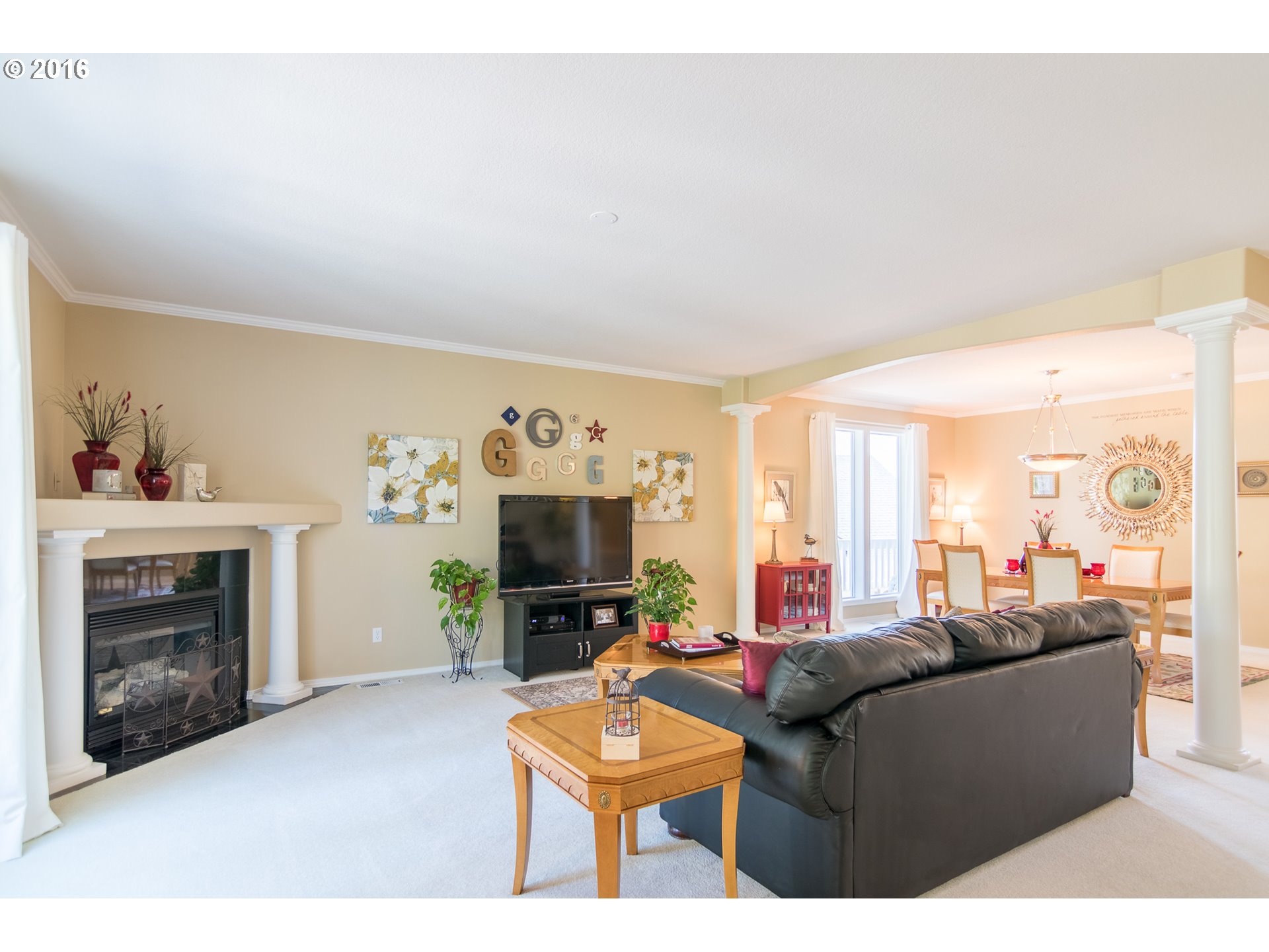15806 Southwest Colyer Way Tigard, OR 97224 - Photo 6 of 32 a living room with furniture a fireplace and a flat screen tv