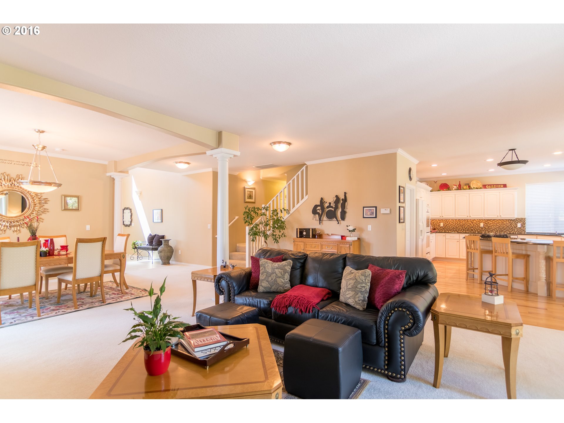 15806 Southwest Colyer Way Tigard, OR 97224 - Photo 8 of 32 a living room with furniture a rug and a painting on the wall