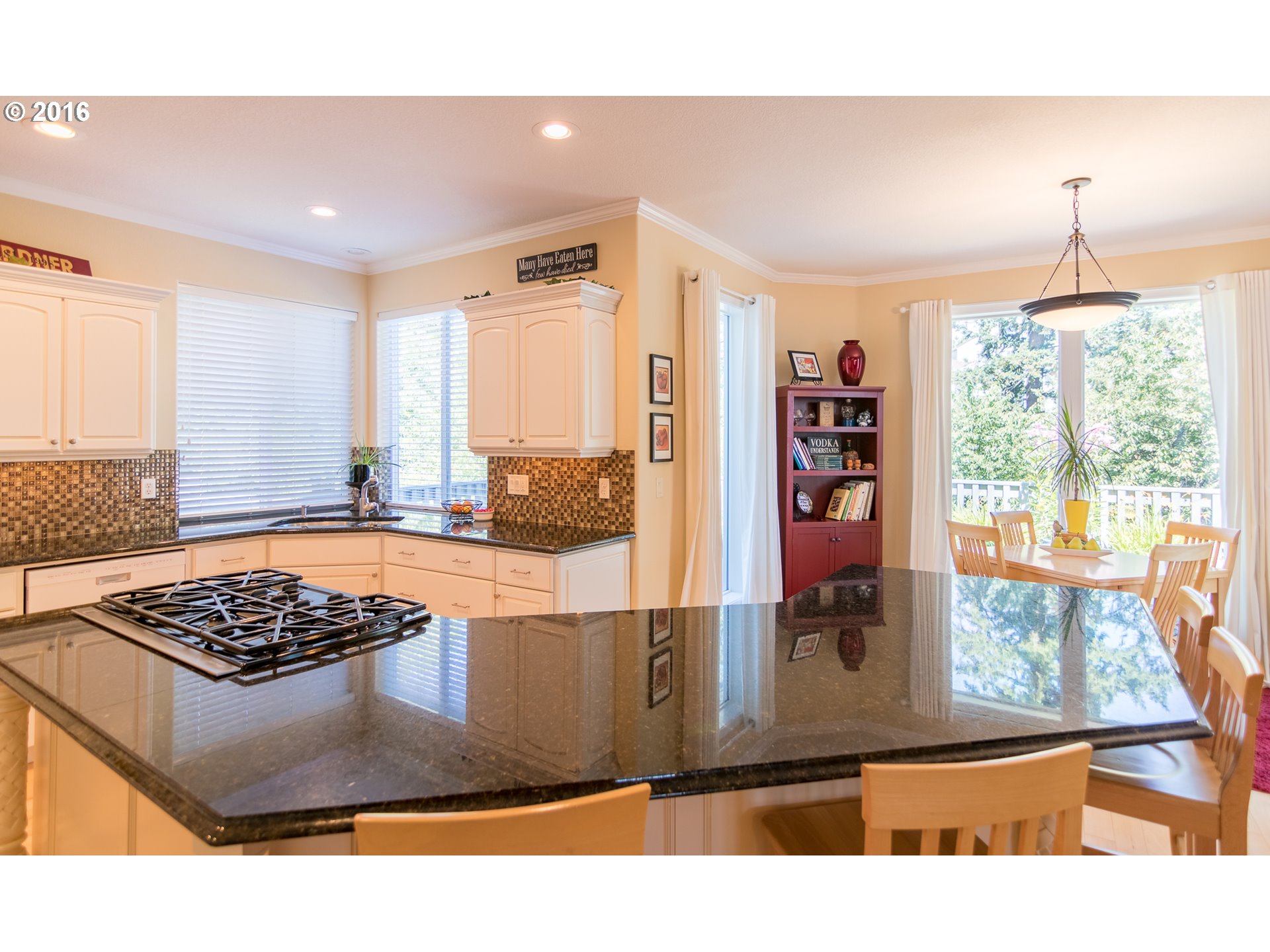 15806 Southwest Colyer Way Tigard, OR 97224 - Photo 9 of 32 a kitchen with a stove a refrigerator and a counter top space