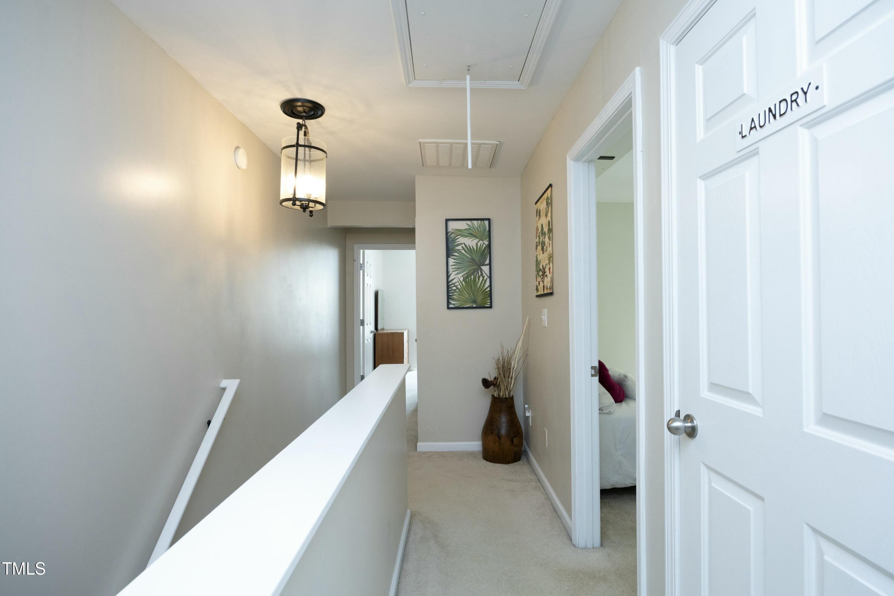 2133 Persimmon Ridge Drive Raleigh, NC 27604 - Photo 16 of 33 Second level hallway to bedrooms and laundry room