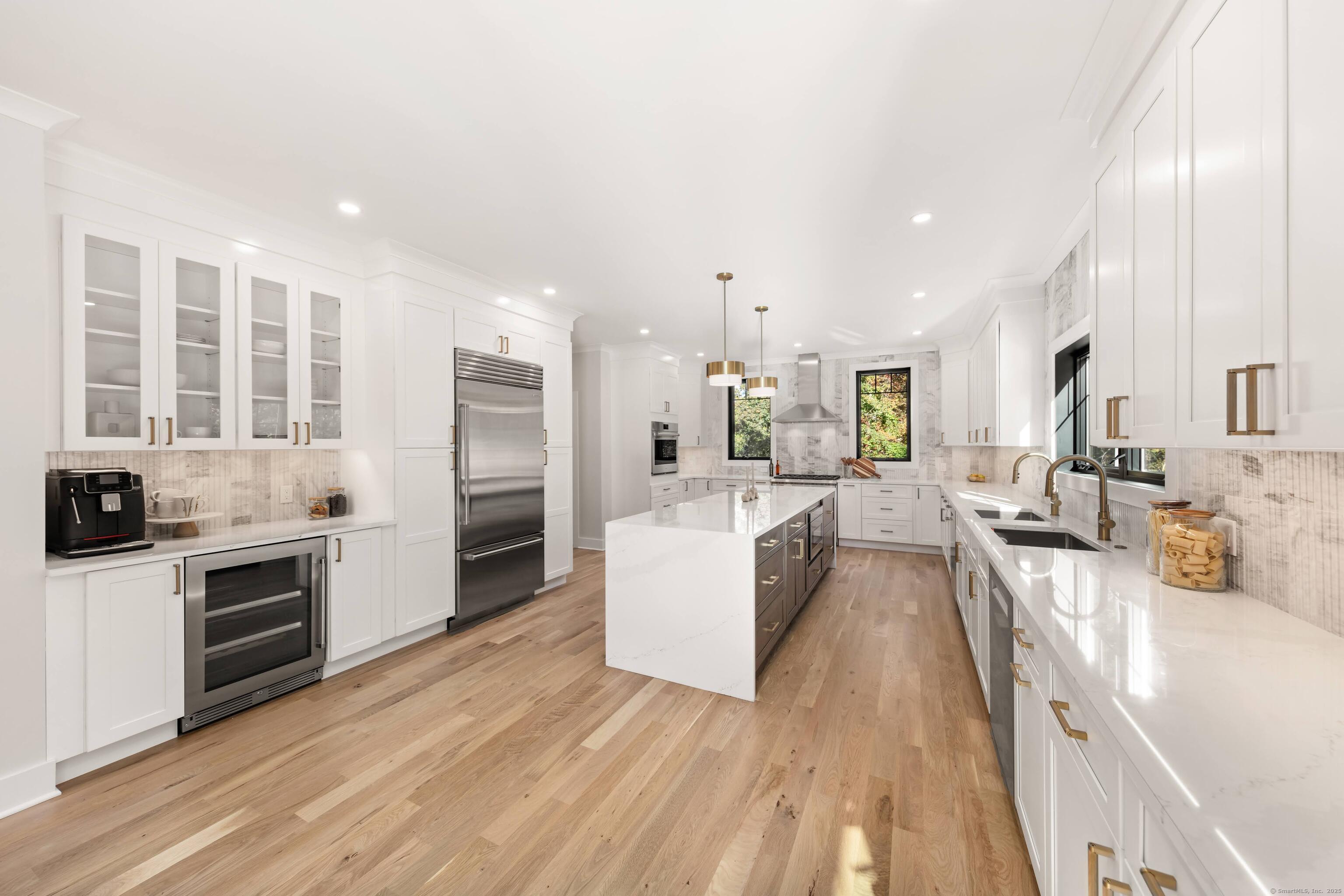 31 Gray Farms Road Stamford, CT 06905 - Photo 13 of 40 a large white kitchen with stainless steel appliances