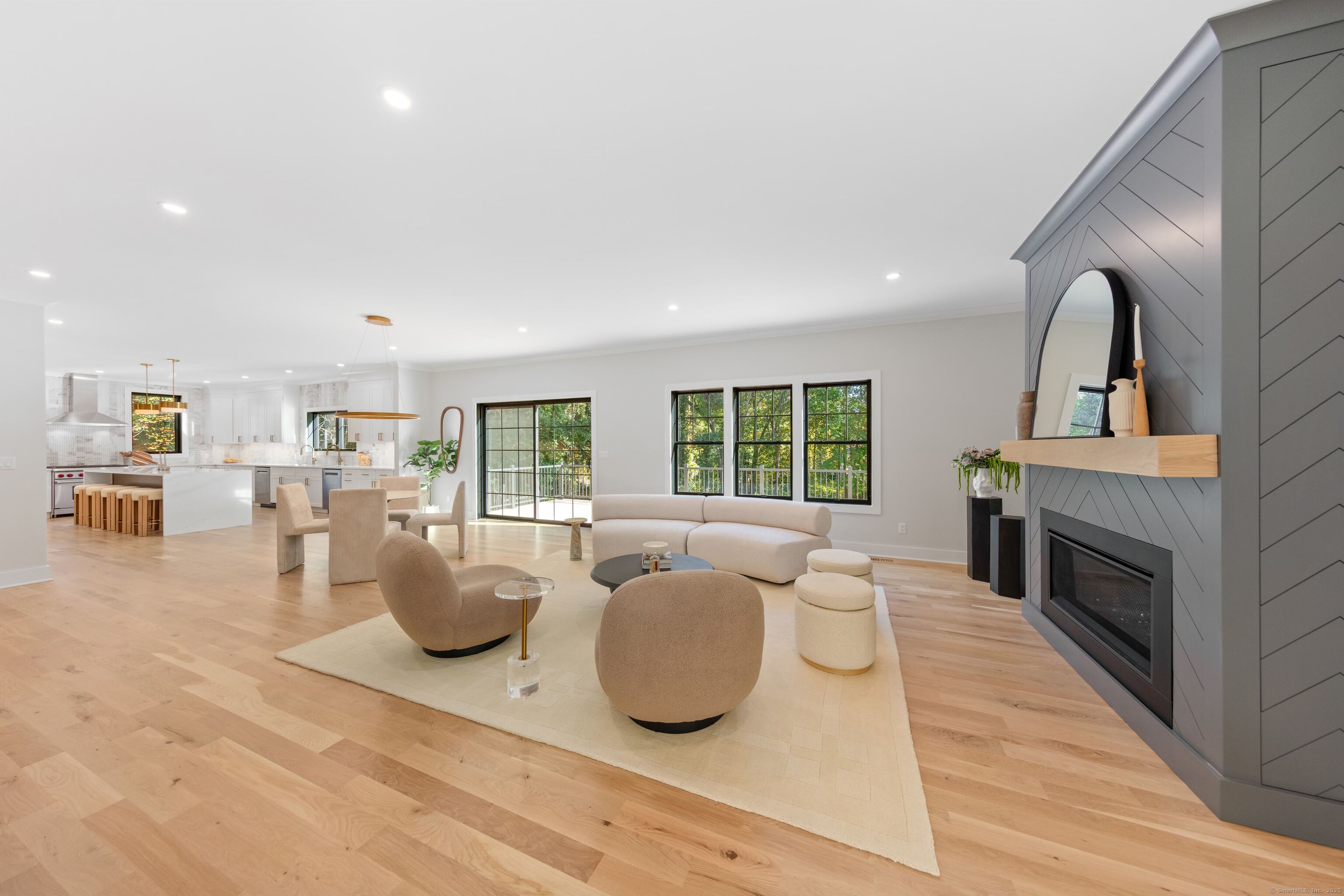 31 Gray Farms Road Stamford, CT 06905 - Photo 17 of 40 Another shot of the family room with the kitchen and breakfast room in the background.