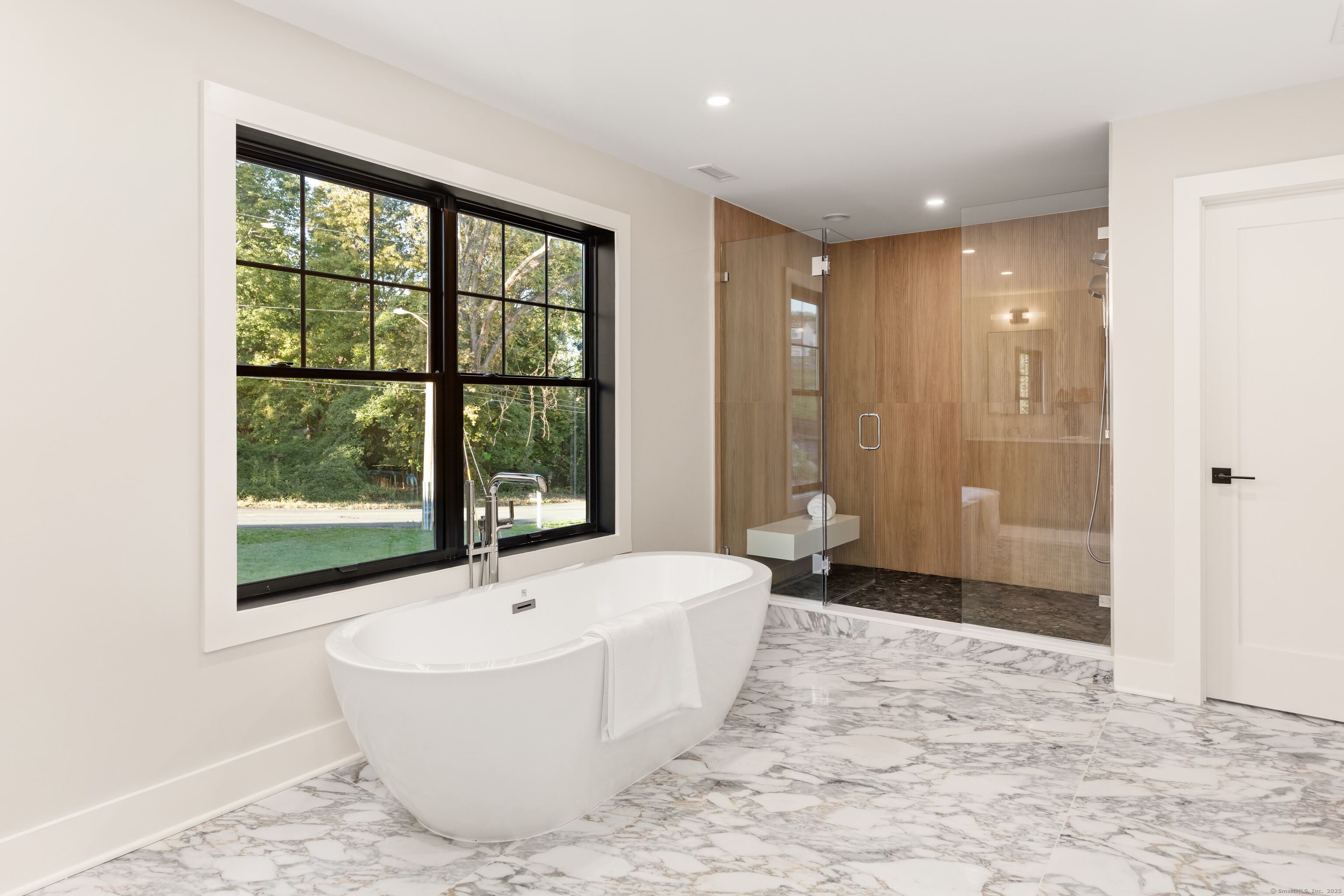 31 Gray Farms Road Stamford, CT 06905 - Photo 24 of 40 Heated floors, soaking tub in front of the windows with a large walk-in shower and in that door is a water closet (i.e. toilet) for full privacy and and functionality.