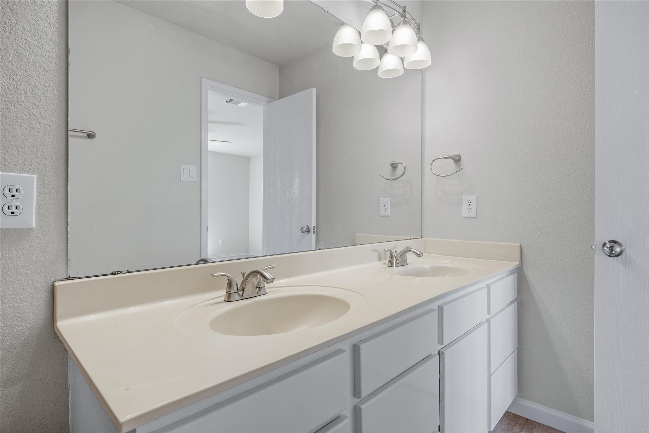 7541 Redrick Drive Austin, TX 78747 - Photo 32 of 40 Bathroom featuring a sink, baseboards, and double vanity