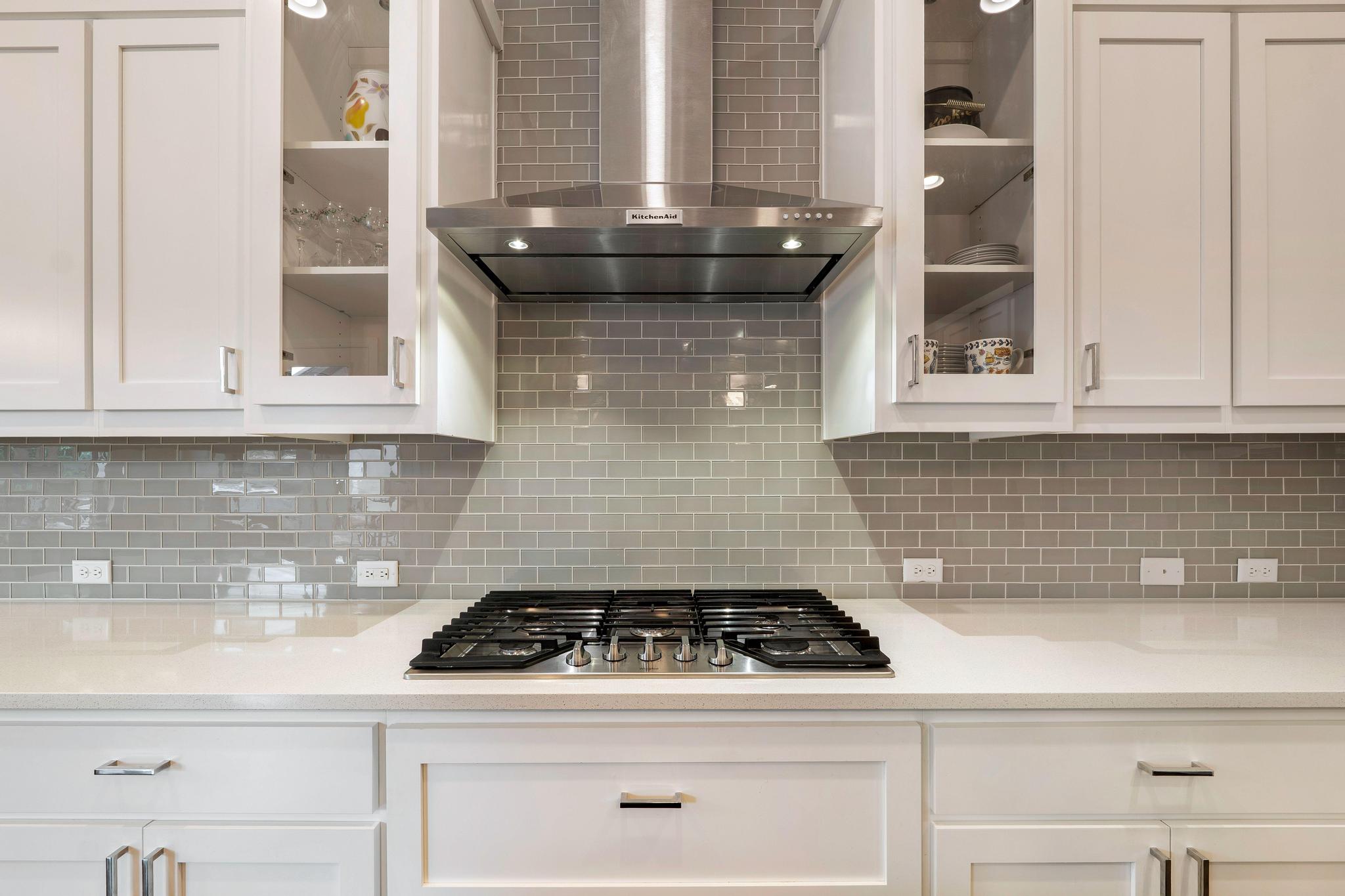 1009 Legacy Crossing Georgetown, TX 78628 - Photo 16 of 40 Culinary delights await with this kitchen's sleek gas cooktop and efficient range hood.