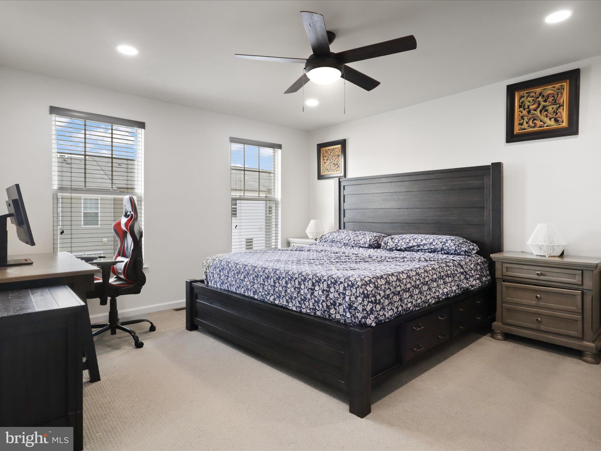 44021 Eastgate View Drive Chantilly, VA 20152 - Photo 17 of 30 a bedroom with a bed desk and a window