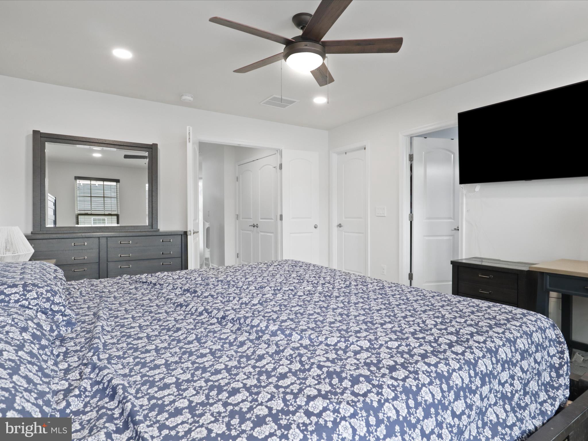 44021 Eastgate View Drive Chantilly, VA 20152 - Photo 20 of 30 a bedroom with a bed and a flat screen tv