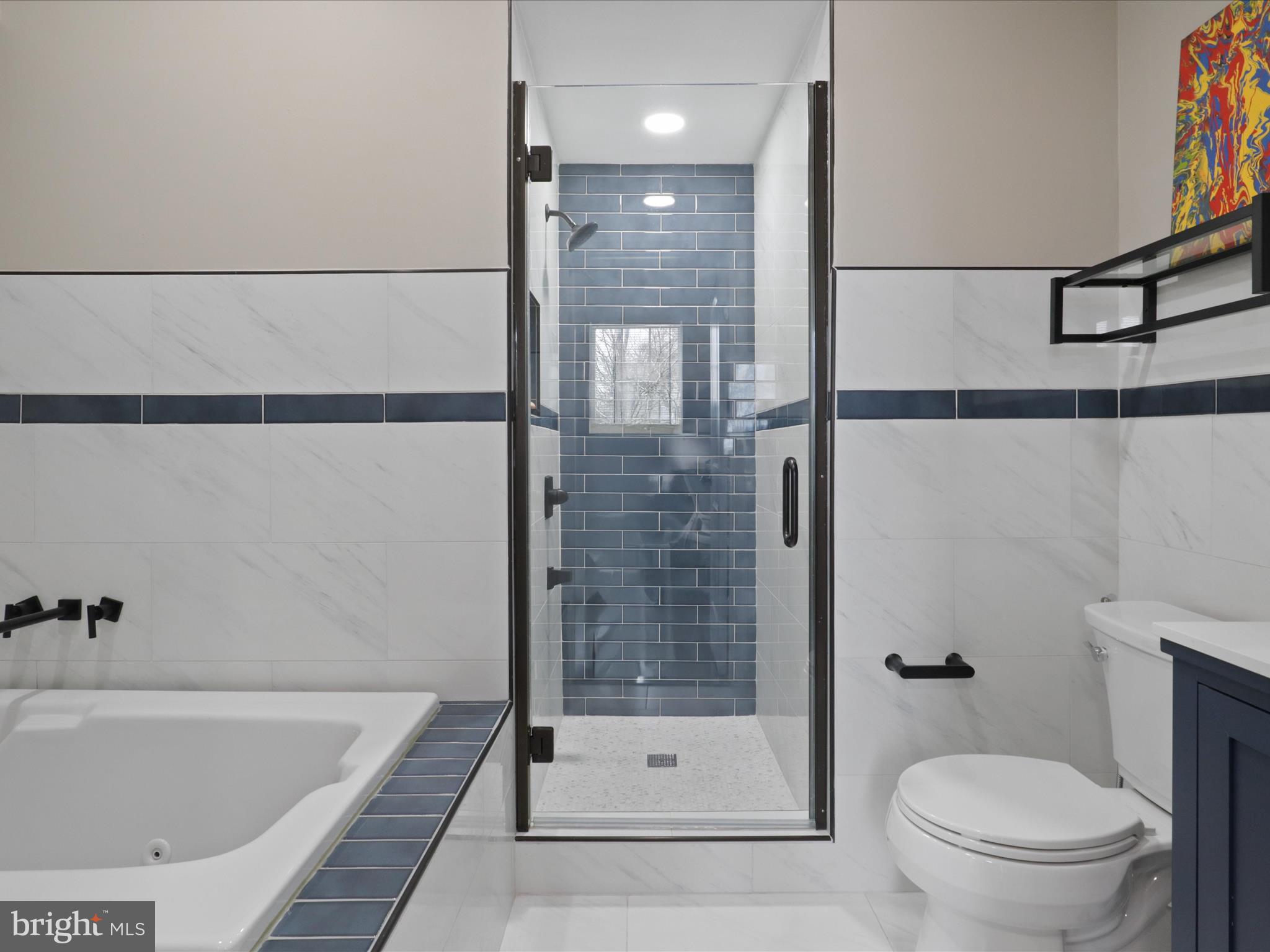 44021 Eastgate View Drive Chantilly, VA 20152 - Photo 7 of 30 a bathroom with a shower and a toilet