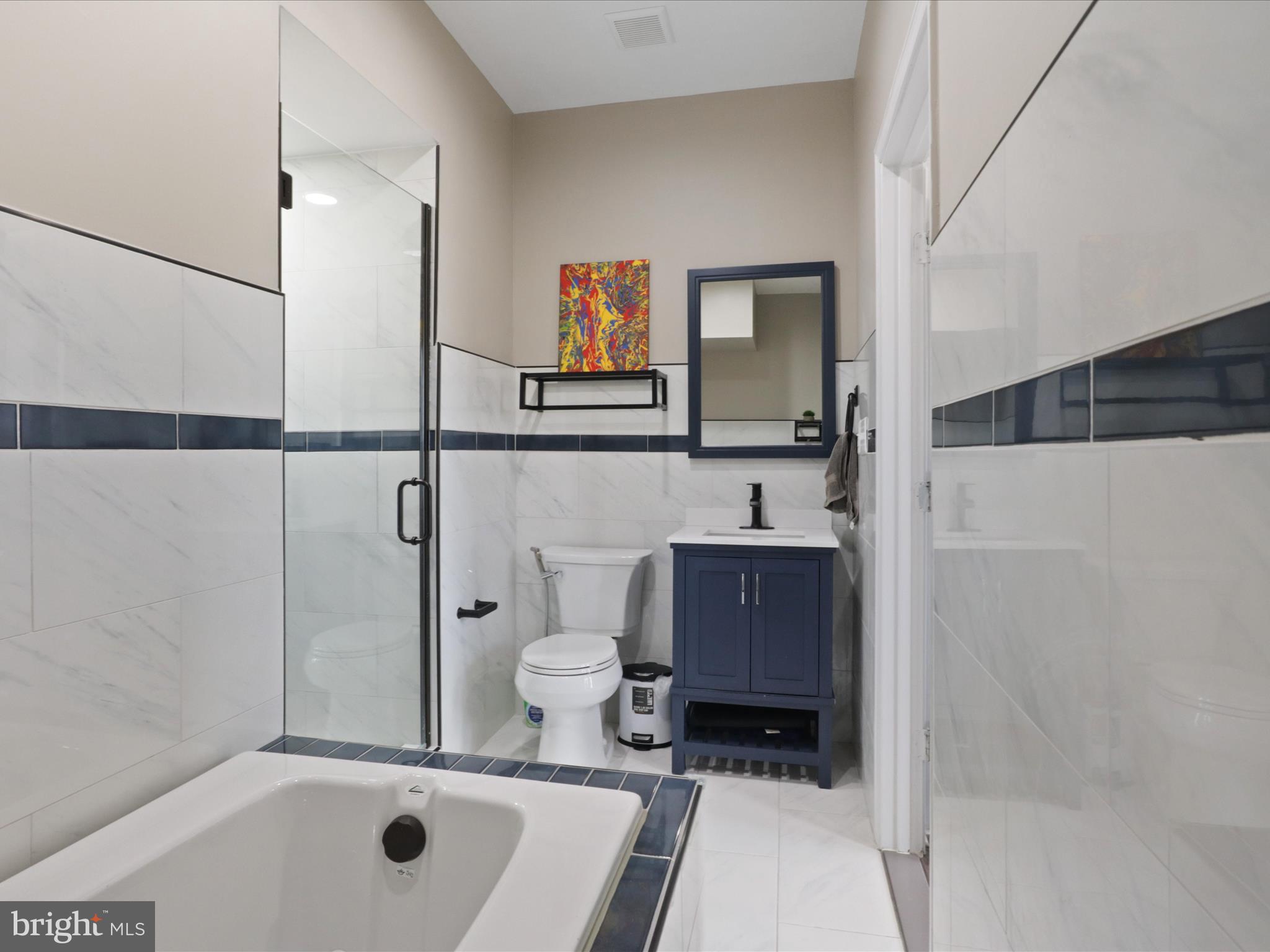 44021 Eastgate View Drive Chantilly, VA 20152 - Photo 8 of 30 a bathroom with a sink a toilet and shower