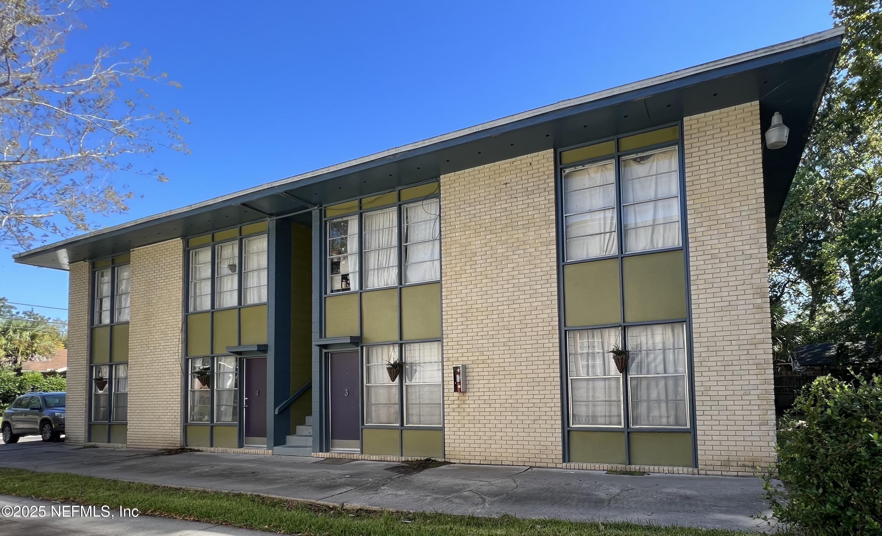 2960 Remington Street, Unit 2 Jacksonville, FL 32205 - Photo 1 of 14 a front view of a house with a garden