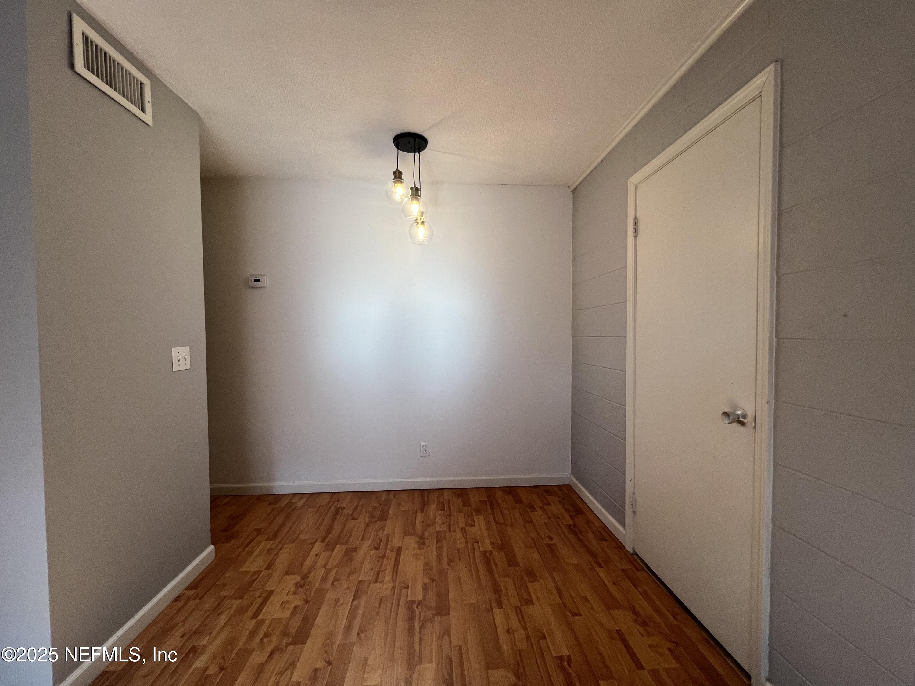 2960 Remington Street, Unit 2 Jacksonville, FL 32205 - Photo 5 of 14 wooden floor in an empty room
