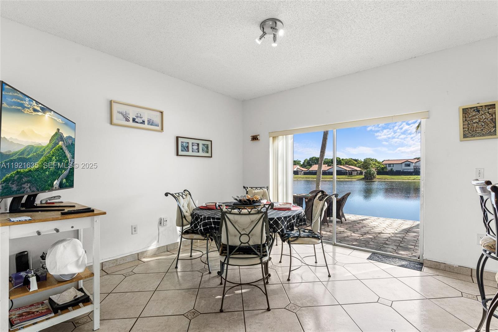 4687 Southwest 153rd Court Miami, FL 33185 - Photo 13 of 40 a dining room with furniture and kitchen view
