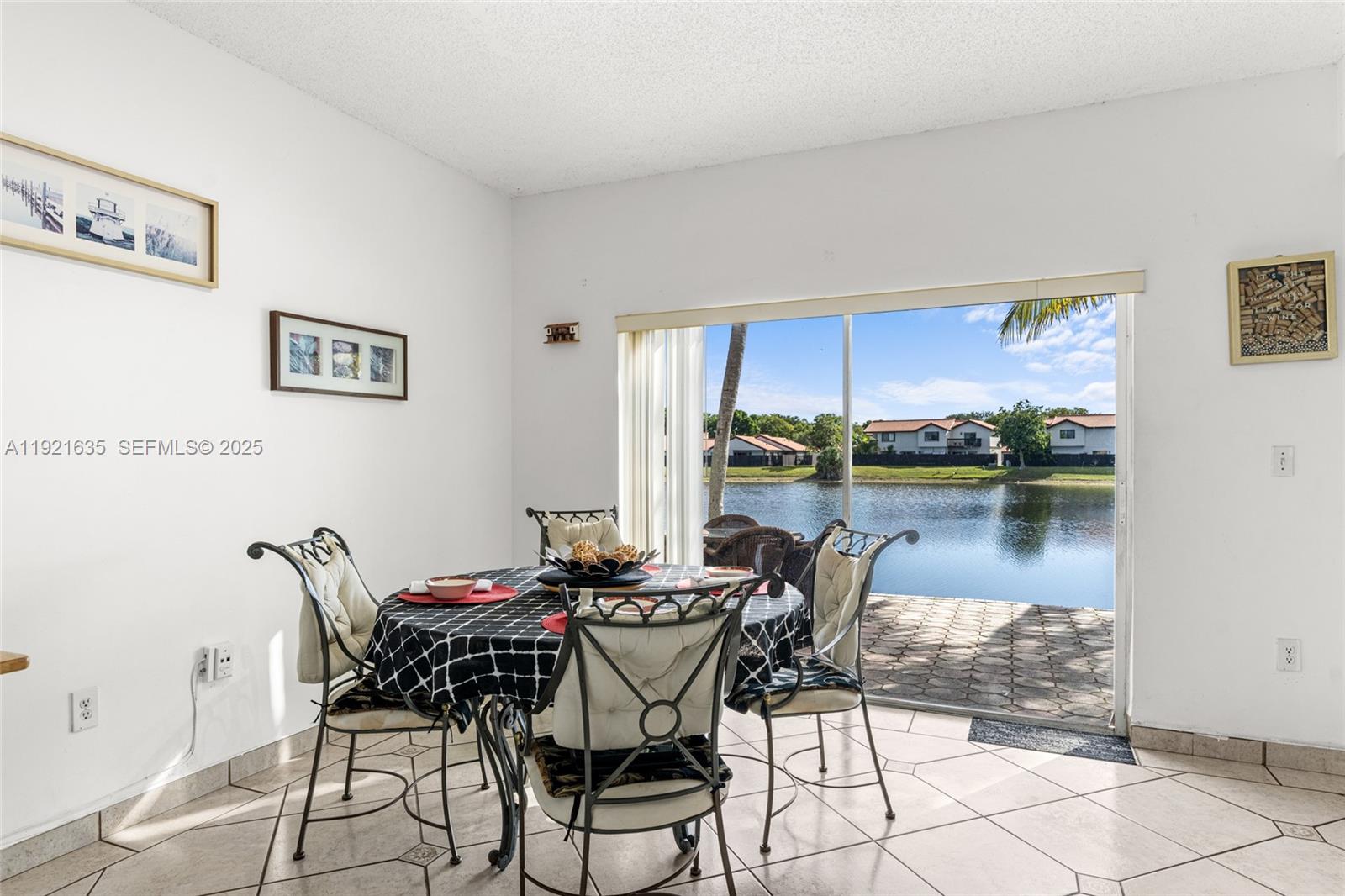 4687 Southwest 153rd Court Miami, FL 33185 - Photo 14 of 40 a dining room with furniture and a floor to ceiling window