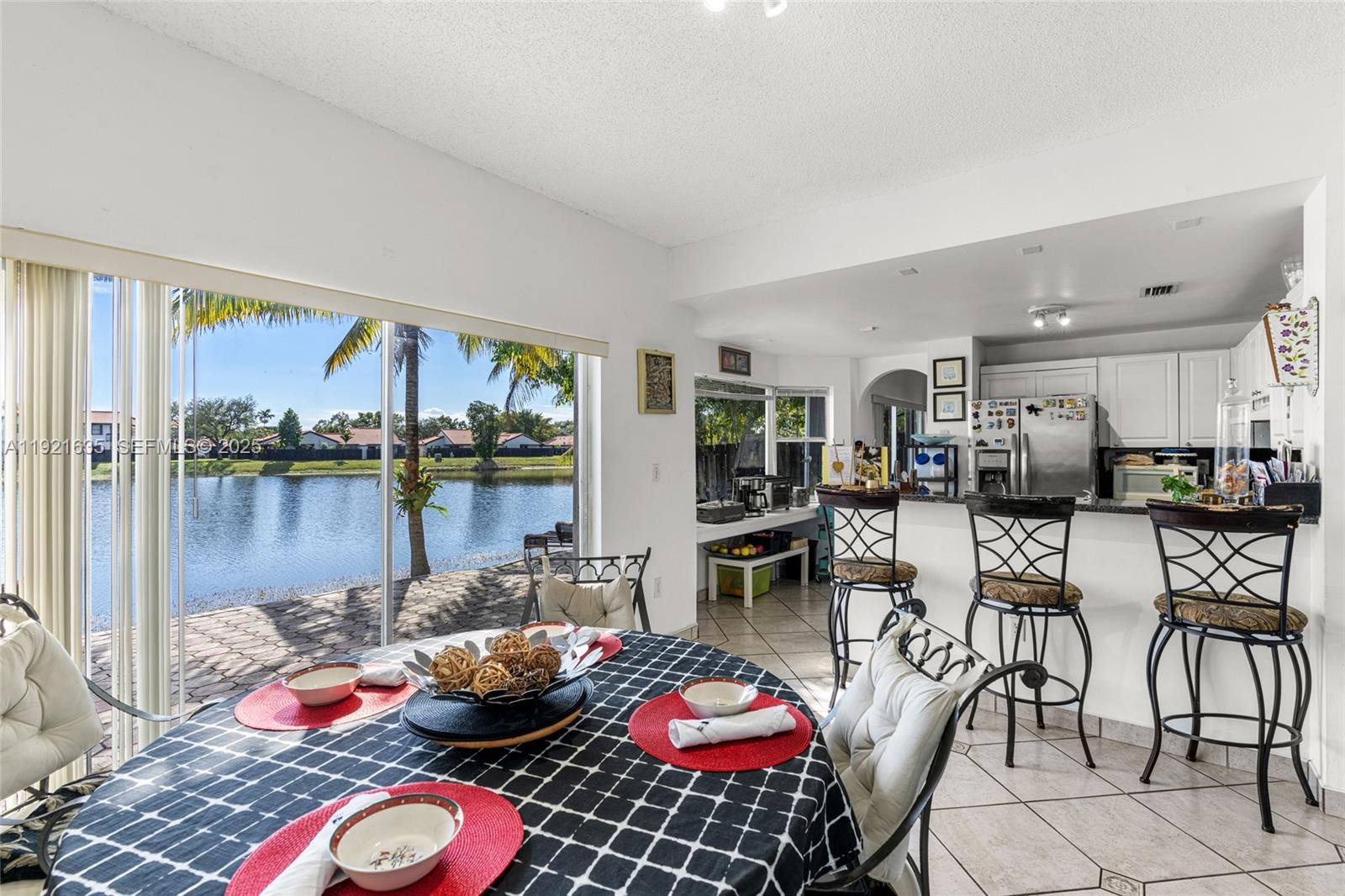4687 Southwest 153rd Court Miami, FL 33185 - Photo 15 of 40 a living room with furniture and a floor to ceiling window