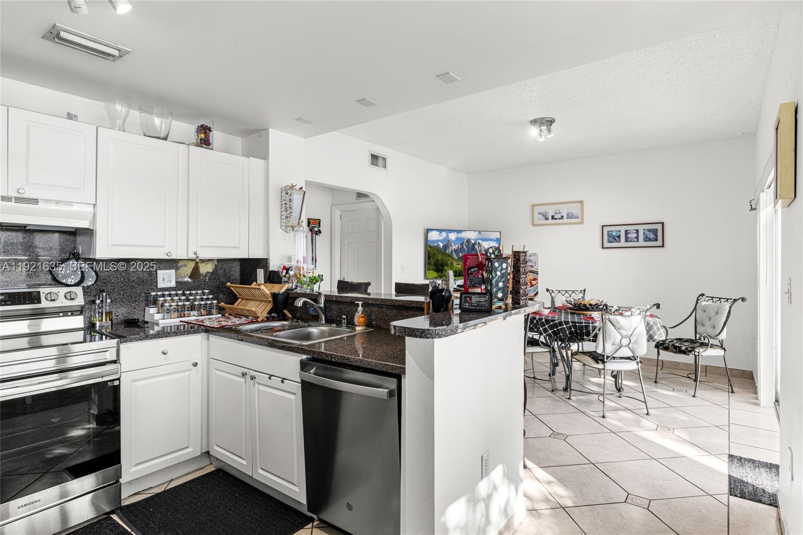 4687 Southwest 153rd Court Miami, FL 33185 - Photo 18 of 40 a kitchen with a sink and cabinets