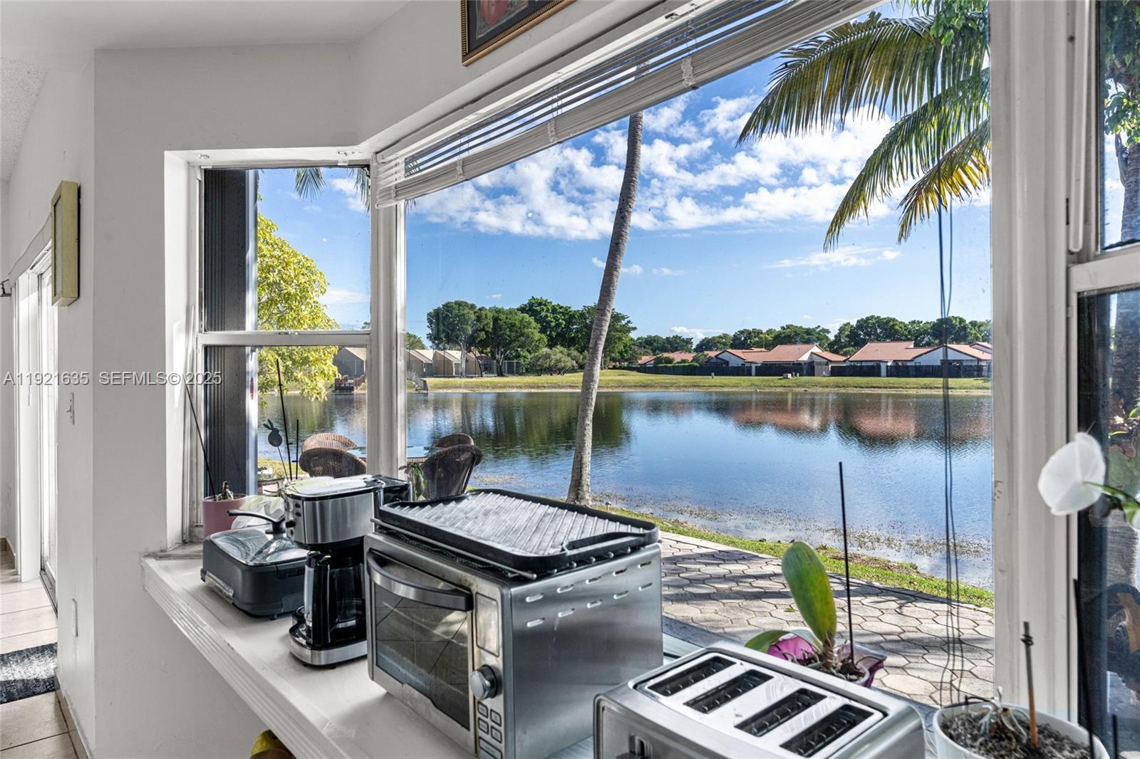 4687 Southwest 153rd Court Miami, FL 33185 - Photo 19 of 40 a view of a chairs and table in a balcony