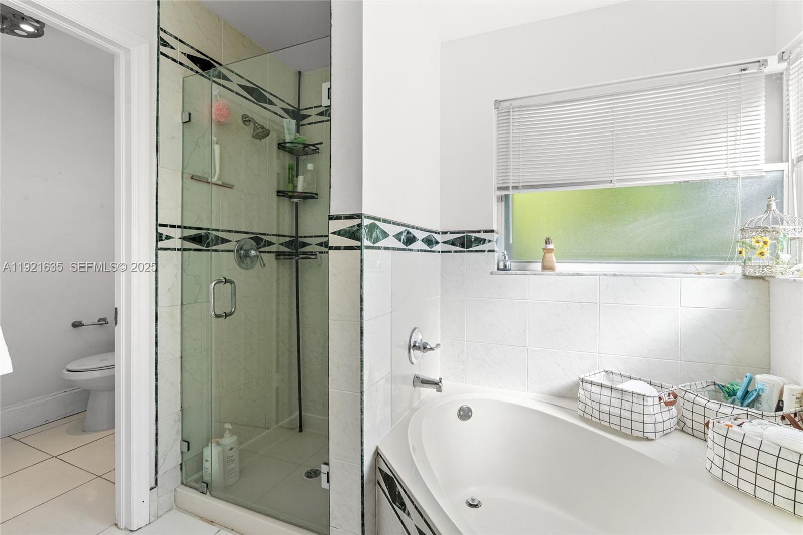 4687 Southwest 153rd Court Miami, FL 33185 - Photo 23 of 40 a bathroom with a bathtub and a shower