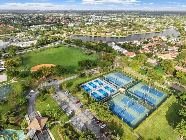 an aerial view of residential houses with outdoor space