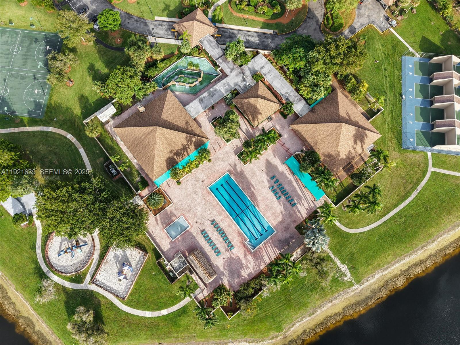 4687 Southwest 153rd Court Miami, FL 33185 - Photo 32 of 40 an aerial view of a house a yard and a swimming pool